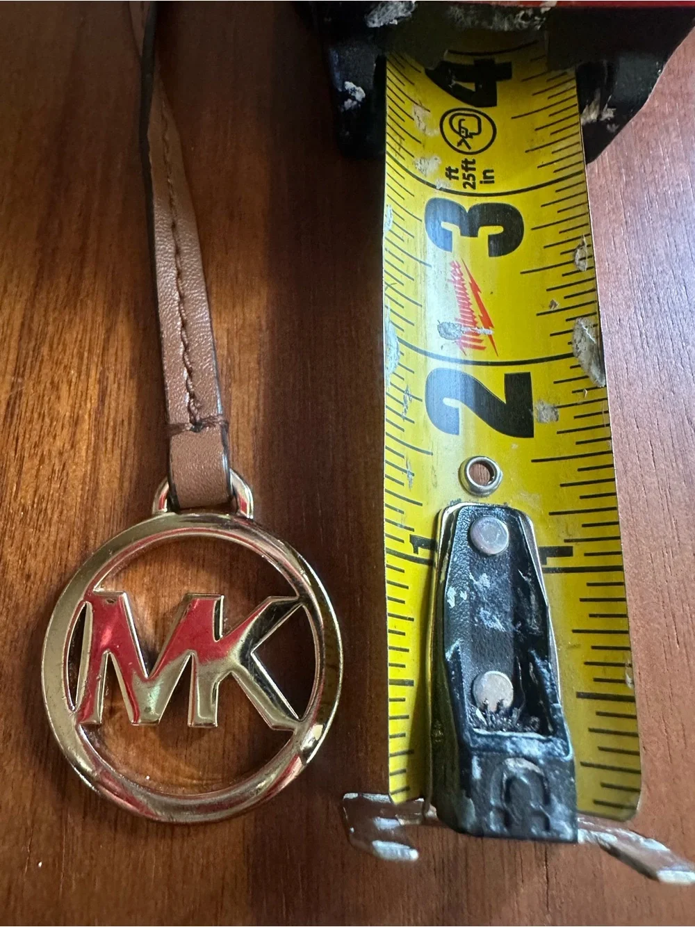 Michael Kors Brown Leather Strap Keyring with Gold MK Emblem and Red Inset